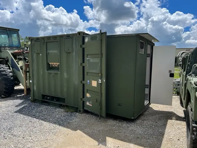 Green field container unit under a blue sky