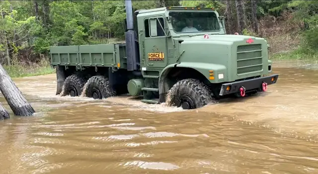 Force 1 Logistics truck crossing a flooded road