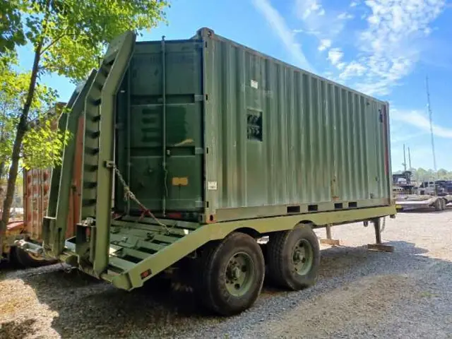 Green container trailer with entry stairs