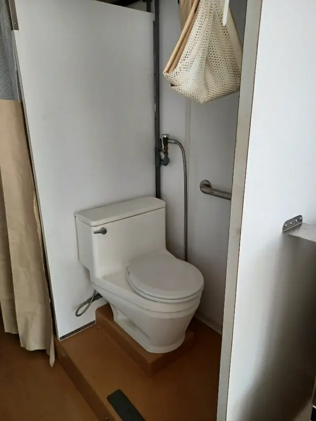 Restroom inside a support trailer